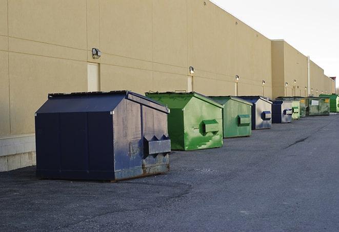 a collection of bright and vibrant dumpsters in a construction zone in Bellevue, WA